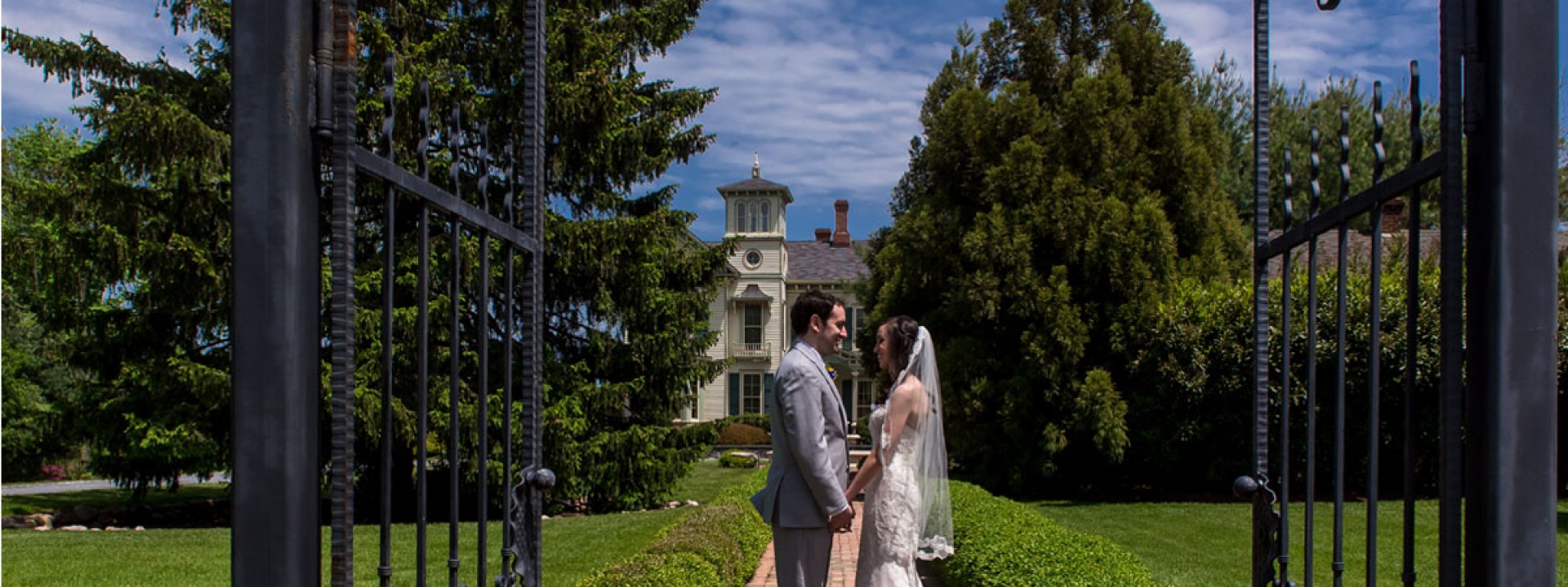 Bride and groom at the gate, Lisa Nicolosi photography